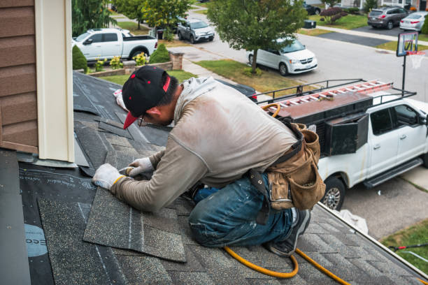 Professional Storm Damage Roof Repair technician working in Roslyn, PA